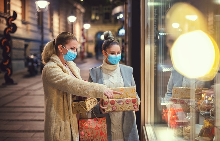 Family Shopping Christmas Gifts During Covid 19 Pandemic. They Wears A Protective Mask To Protect From Coronavirus Covid 19.