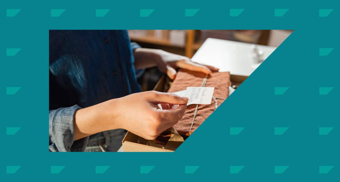 How to Do Retention Marketing: Female customer unboxing a product with a thank you note.