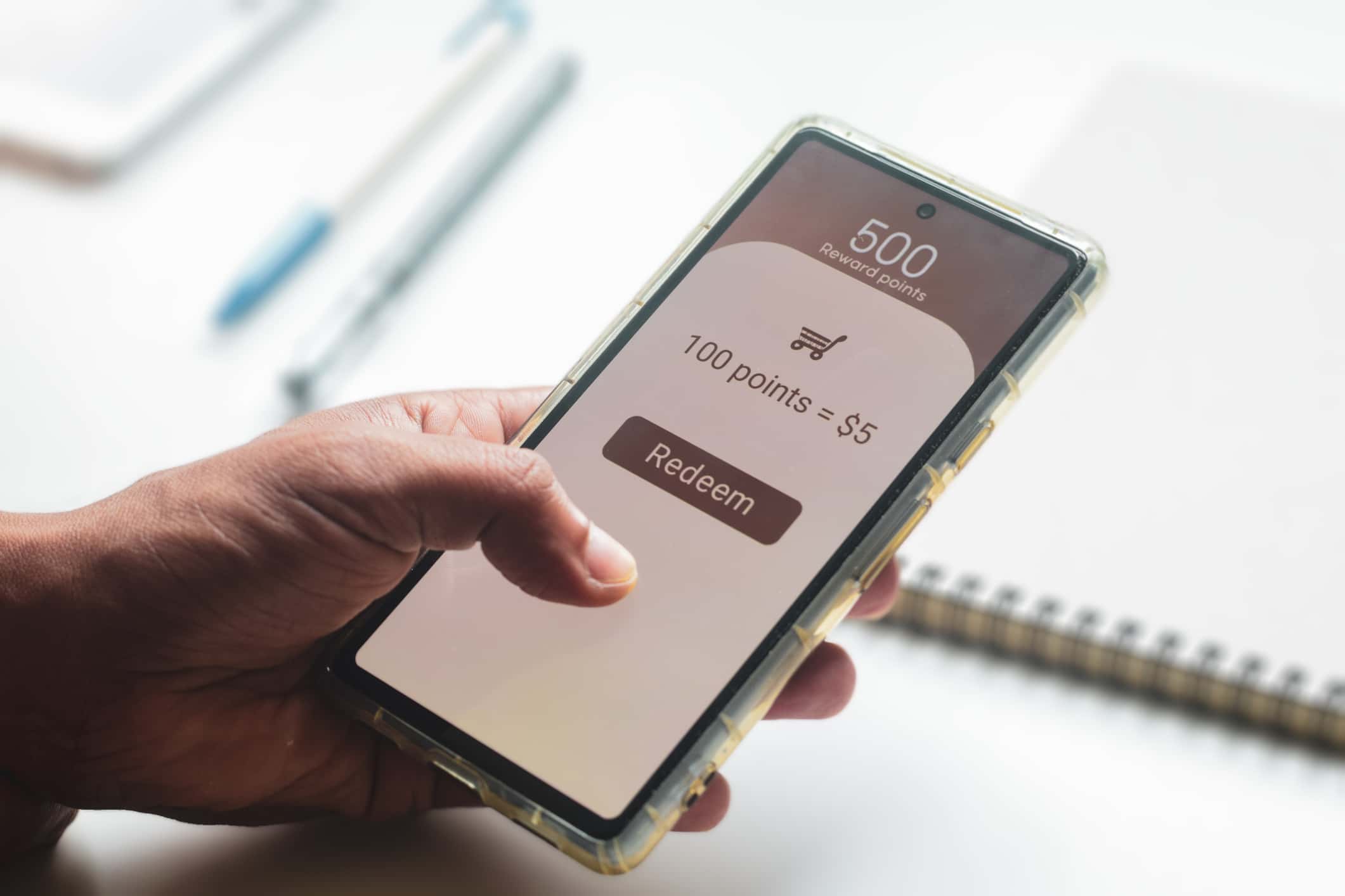 Man Trying To Transfer Redeem Rewards Points Into Cash On His Mobile Phone. Loyalty Programs To Increase Customer Engagement In Digital Marketing Concepts. Selective Focus.