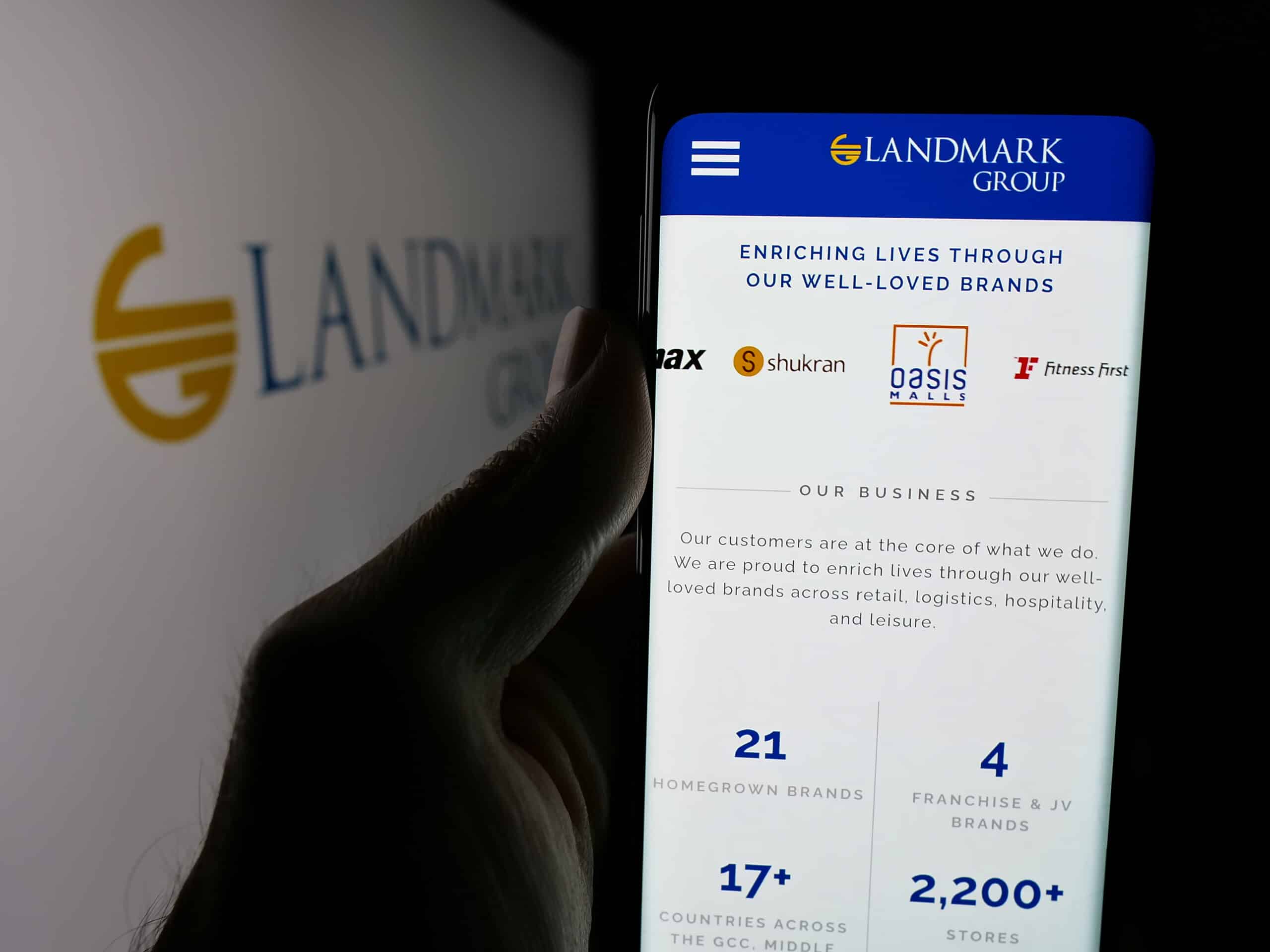 Stuttgart Germany 04 28 2025: Person Holding Smartphone With Website Of Uae Holding Company Landmark Group On Screen In Front Of Logo. Focus On Center Of Phone Display.