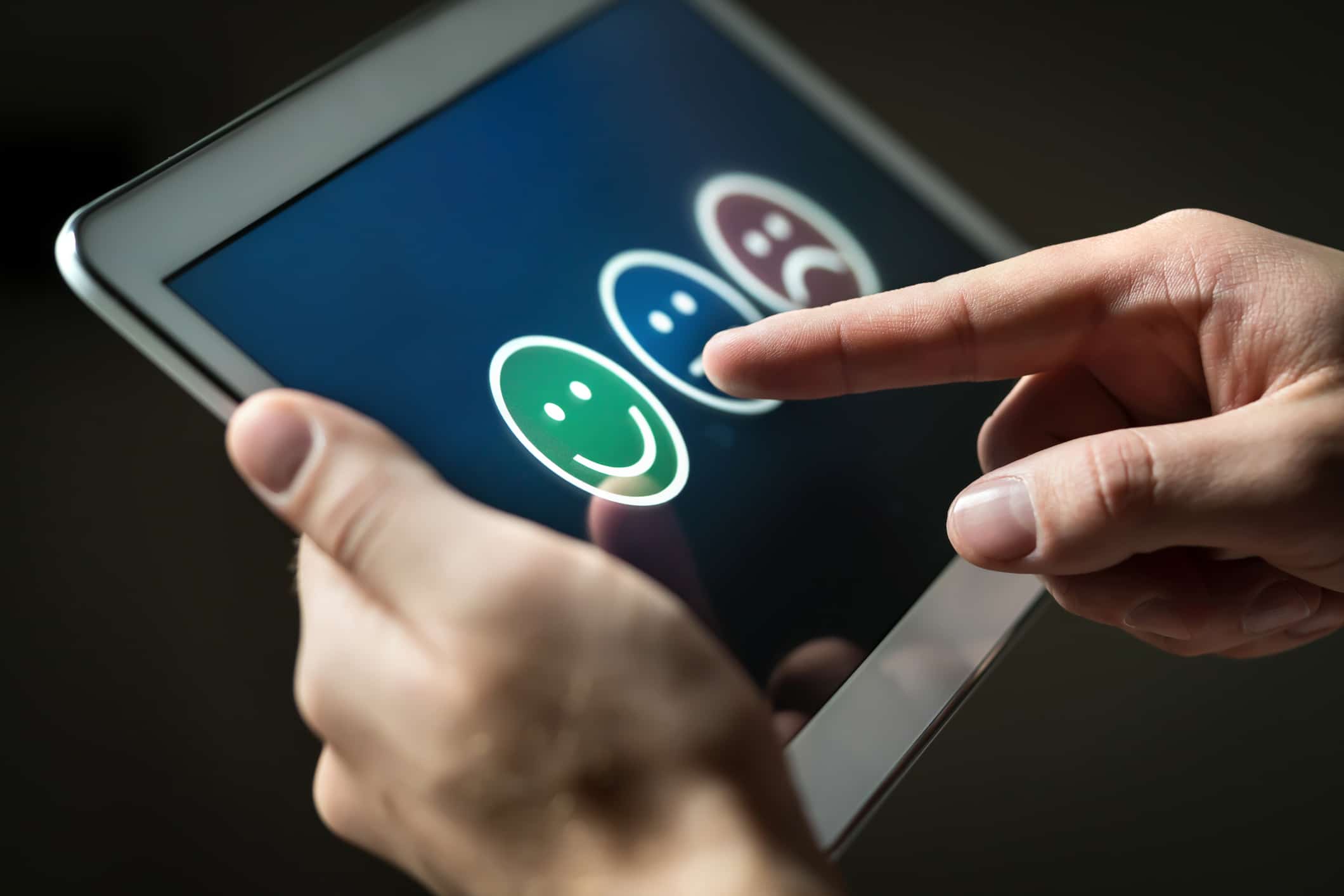 Man Using Tablet To Give Review Opinion And Feedback To Survey Poll Or Questionnaire For User Experience Or Customer Satisfaction Research. Technology For Service Quality Control.