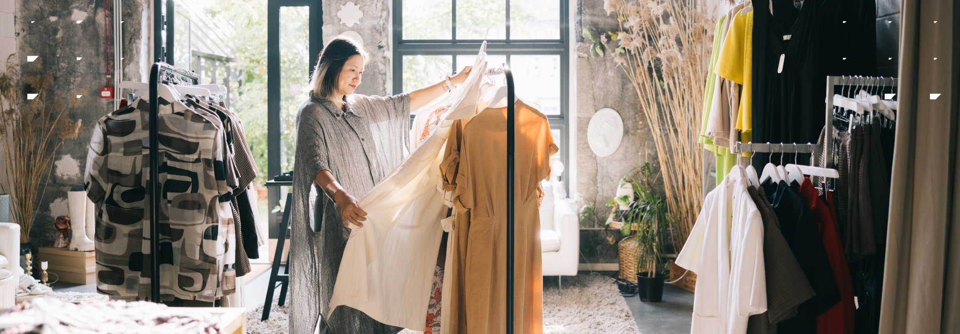 Customer loyalty: A female customer browses in her favorite clothing retail store.