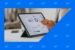 Marketer zooming in on metrics on a tablet dashboard screen.
