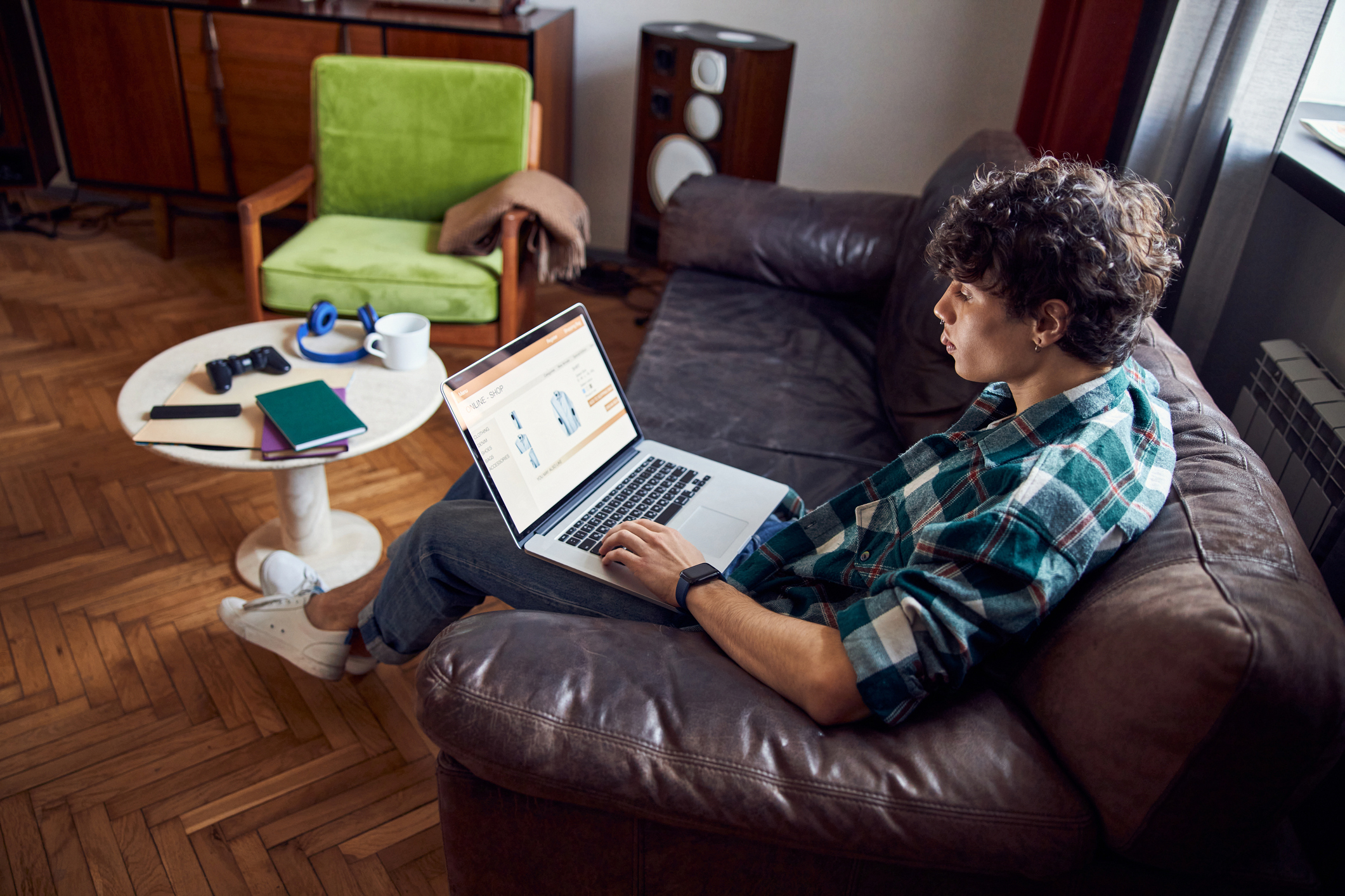 Handsome Guy Using Laptop For Online Shopping At Home