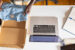 unboxing some clothing on a desk | B2C marketing trends