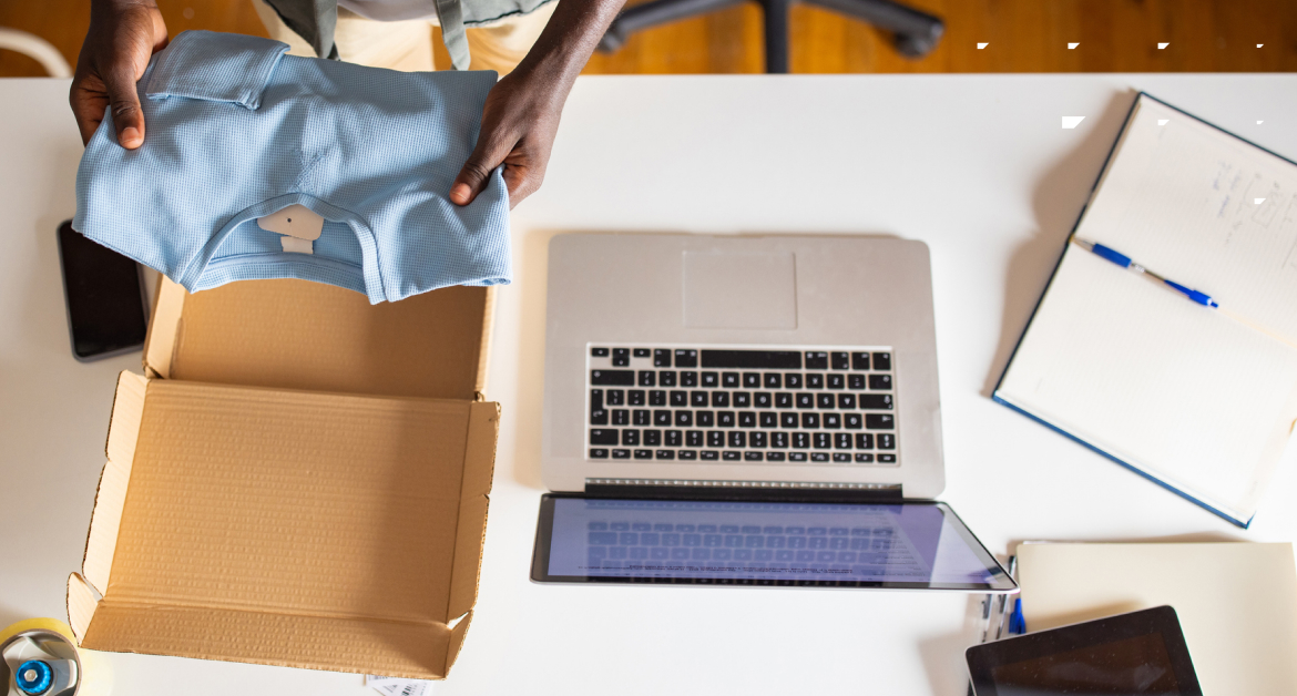 unboxing some clothing on a desk | B2C marketing trends