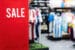 A sports retail store with a sale sign.