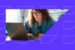 Female marketer looking at customer data on a laptop