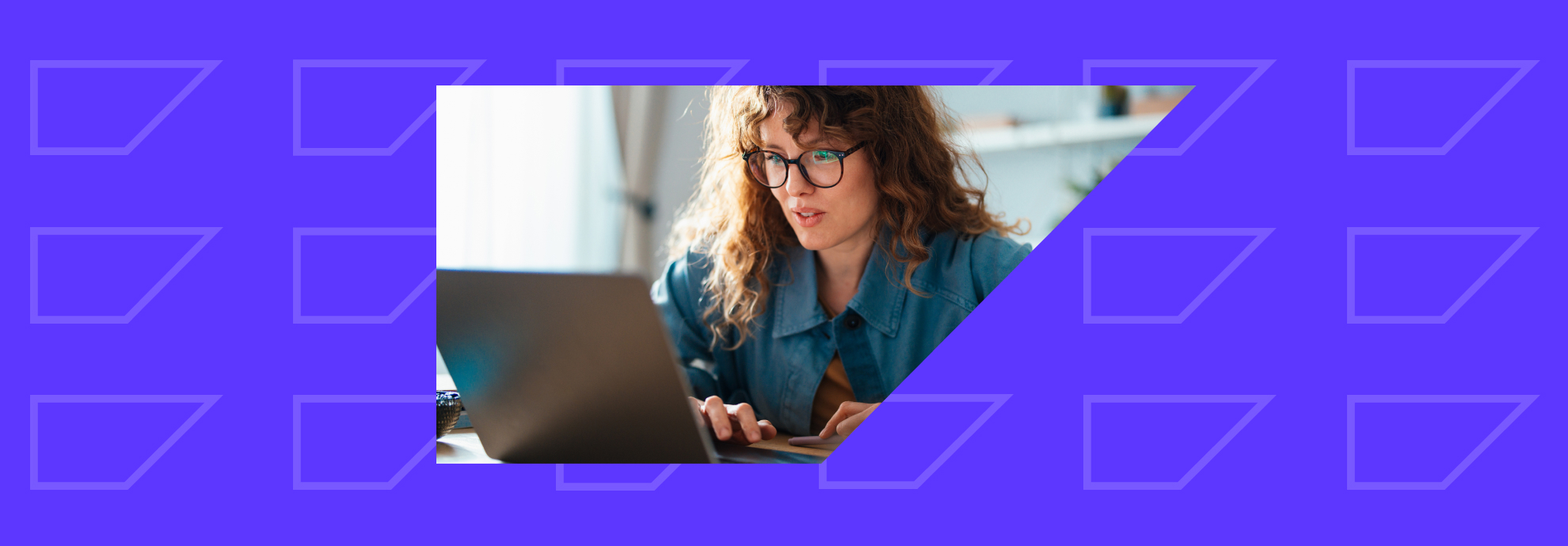 Female marketer looking at customer data on a laptop